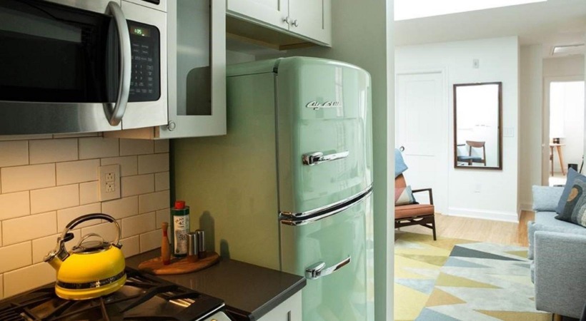 Gourmet kitchen fit for a host a kitchen with a refrigerator and microwave