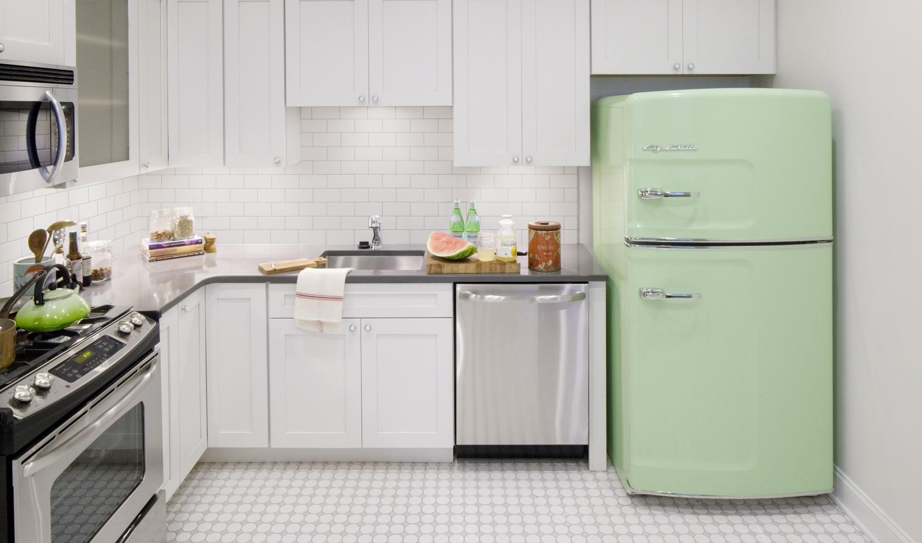 Spacious kitchens with thoughtful details a kitchen with white cabinets