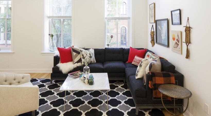 Unwind, entertain, repeat a living room with a couch and coffee table